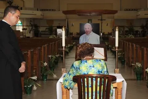 Governor General Dame Cynthia Pratt signs the Book of Condolence on the Passing of Pope Francis