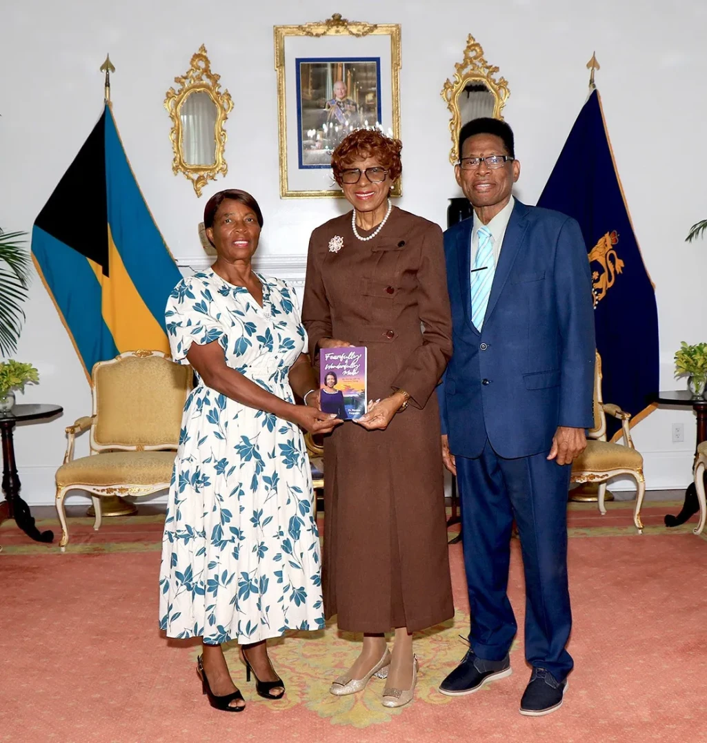 Mrs. Rovena Ferguson presents her book to the Governor General
